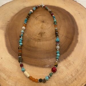 Handmade stone and glass bead necklace with silver tone accents, 18” long.